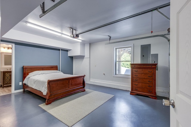 1545 Gravel Hill Rd, Columbia, TN 38401 - bedroom with a garage, baseboards, finished concrete floors, and ensuite bathroom