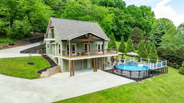 1545 Gravel Hill Rd, Columbia, TN 38401 - rear view of house with fence, an attached garage, a yard, and driveway
