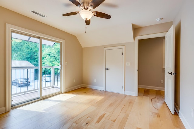 1545 Gravel Hill Rd, Columbia, TN 38401 - unfurnished bedroom with visible vents, access to exterior, baseboards, light wood finished floors, and vaulted ceiling