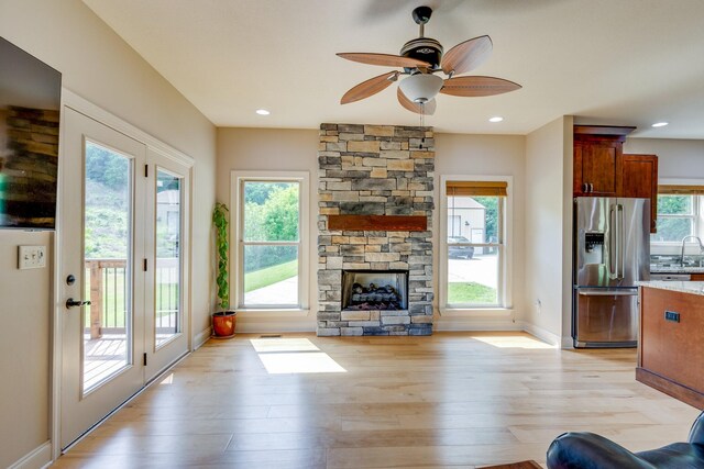 1545 Gravel Hill Rd, Columbia, TN 38401 - living room with baseboards, light wood finished floors, ceiling fan, and a fireplace