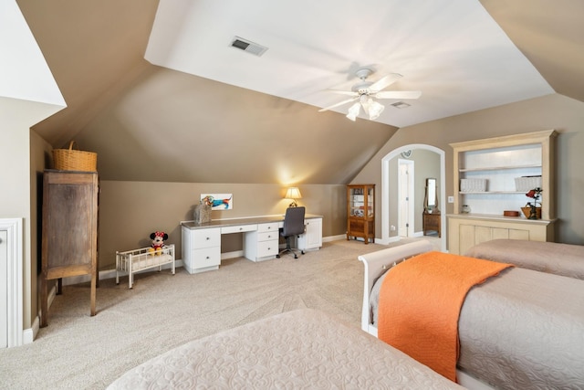 bedroom featuring visible vents, ceiling fan, lofted ceiling, and light carpet