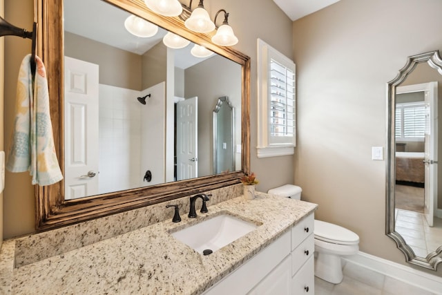full bathroom featuring vanity, tile patterned floors, a shower, and toilet