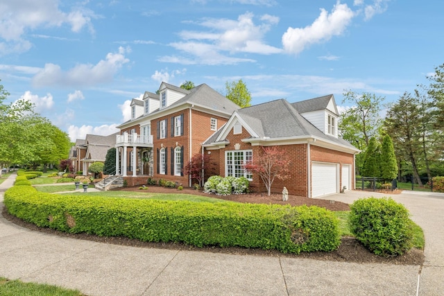 view of front of house with concrete driveway and brick siding