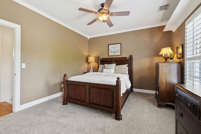 bedroom featuring baseboards, visible vents, light carpet, and ornamental molding
