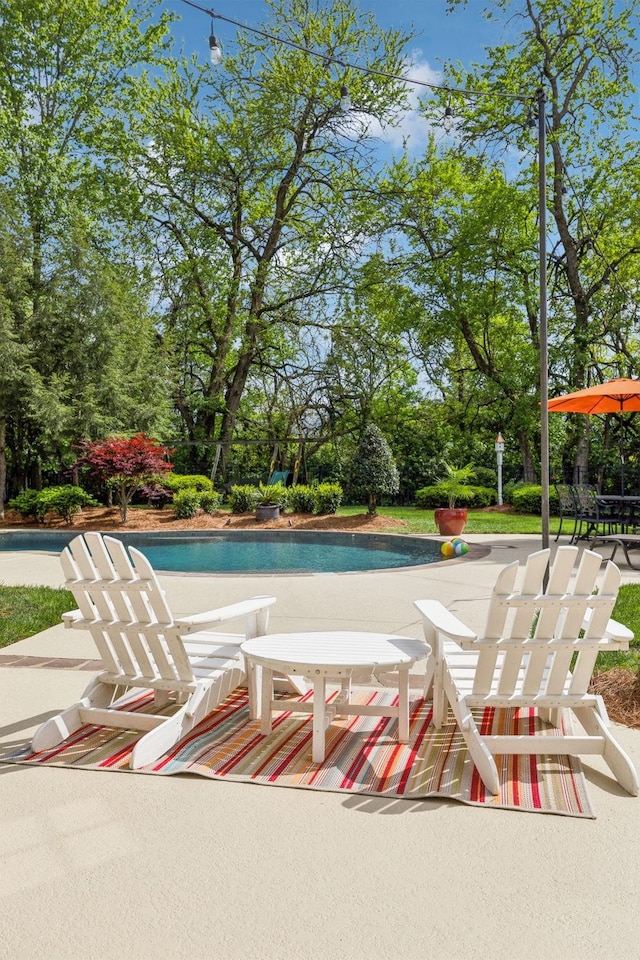 outdoor pool with a patio