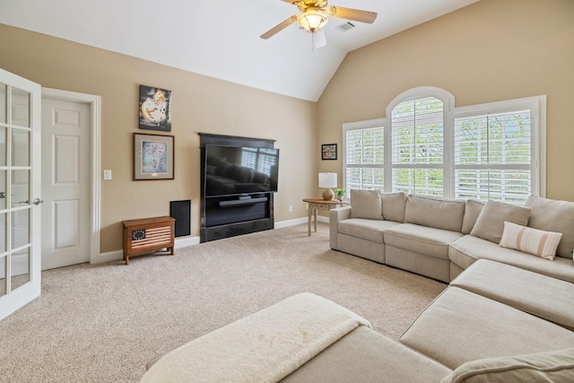 carpeted living room featuring baseboards, ceiling fan, high vaulted ceiling, and visible vents