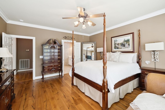 bedroom with connected bathroom, ceiling fan, light wood finished floors, visible vents, and ornamental molding