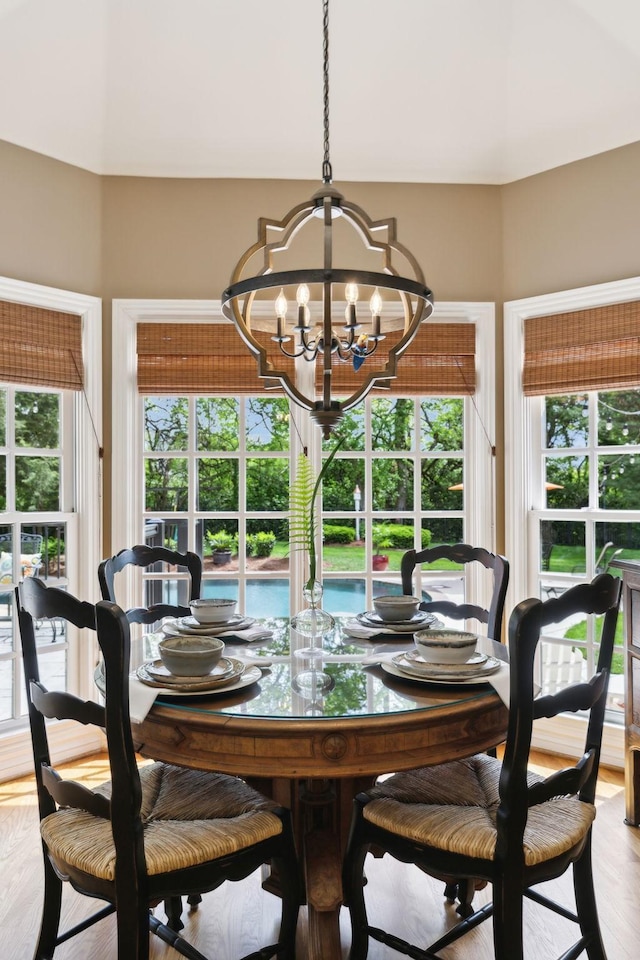 dining area featuring a notable chandelier and a healthy amount of sunlight