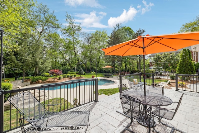 outdoor pool featuring a patio and outdoor dining area