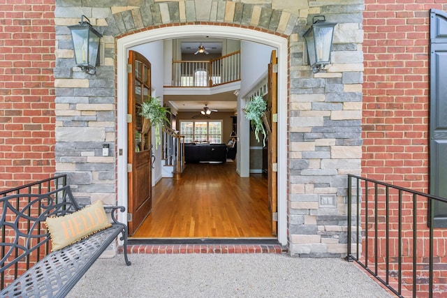entrance to property with brick siding and stone siding