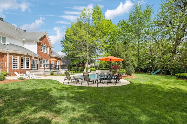 view of yard with a patio and an outdoor pool