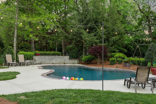 outdoor pool featuring a patio