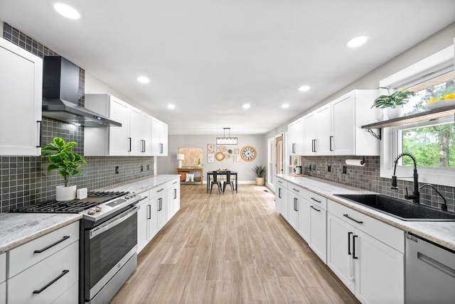 77 Deepwood Est, Cadiz, KY 42211 - kitchen with recessed lighting, wall chimney exhaust hood, white cabinets, a sink, and appliances with stainless steel finishes
