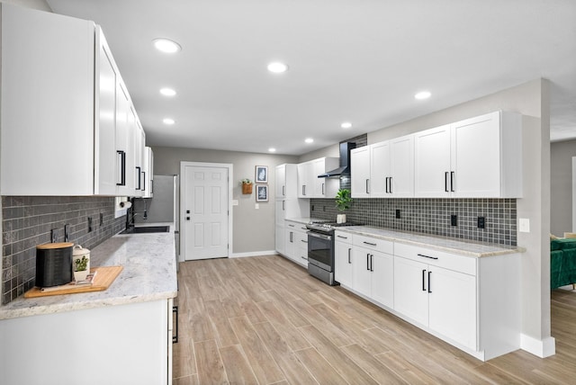 77 Deepwood Est, Cadiz, KY 42211 - kitchen with baseboards, decorative backsplash, stainless steel gas range oven, and wall chimney range hood