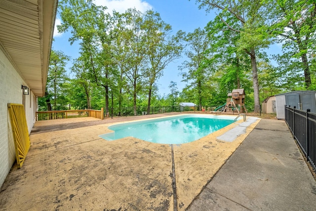 77 Deepwood Est, Cadiz, KY 42211 - view of swimming pool featuring a patio, a fenced in pool, a fenced backyard, and a playground