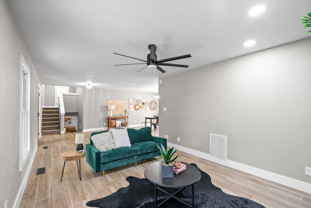 77 Deepwood Est, Cadiz, KY 42211 - living room with ceiling fan, light wood-style flooring, baseboards, visible vents, and stairway