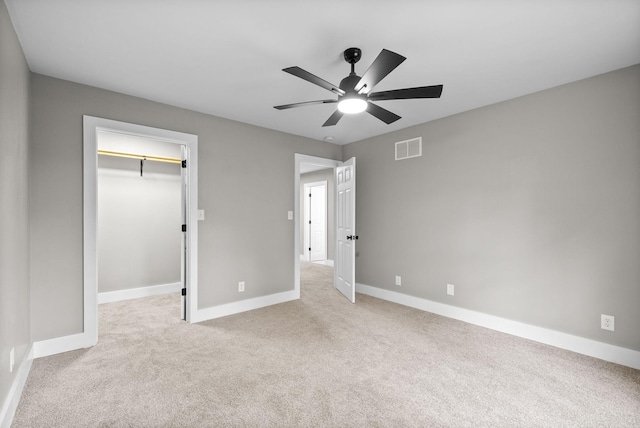 77 Deepwood Est, Cadiz, KY 42211 - unfurnished bedroom with baseboards, a walk in closet, light colored carpet, and visible vents
