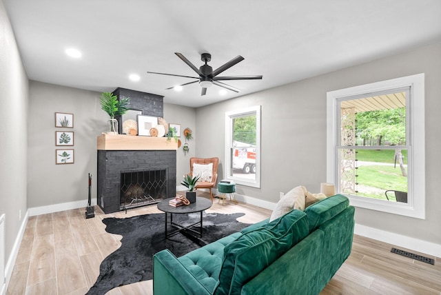 77 Deepwood Est, Cadiz, KY 42211 - living room with visible vents, a ceiling fan, baseboards, and a fireplace