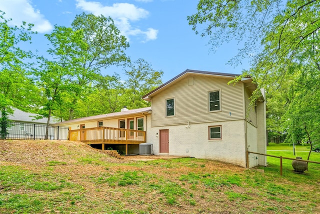 77 Deepwood Est, Cadiz, KY 42211 - back of property featuring central AC, fence, a deck, brick siding, and a yard
