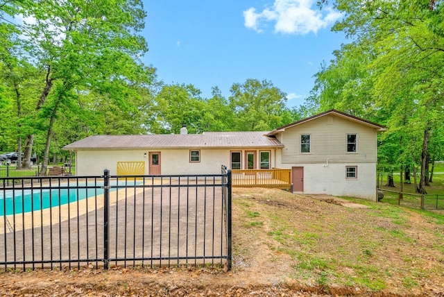 77 Deepwood Est, Cadiz, KY 42211 - back of house featuring a fenced in pool, fence, a patio area, and a deck