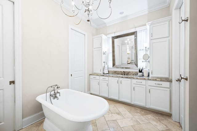 6553 Stableford Ln, Franklin, TN 37069 - bathroom featuring crown molding, vanity, a chandelier, a freestanding tub, and baseboards