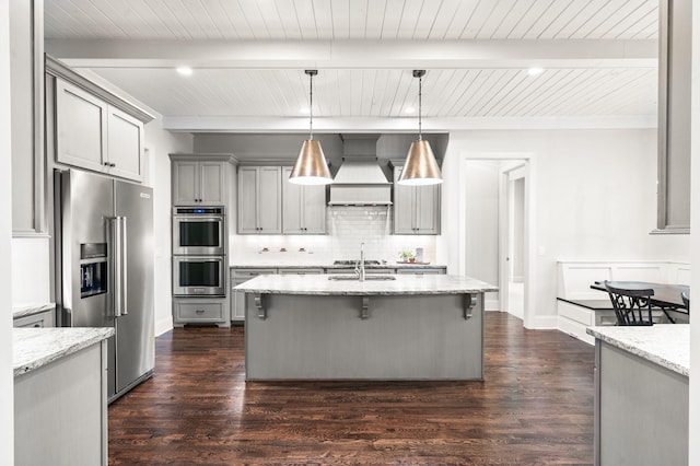 6553 Stableford Ln, Franklin, TN 37069 - kitchen with gray cabinets, appliances with stainless steel finishes, wooden ceiling, beamed ceiling, and custom range hood