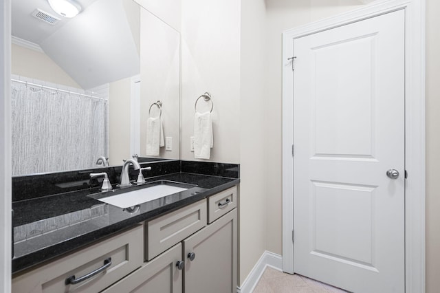 6553 Stableford Ln, Franklin, TN 37069 - full bathroom with visible vents, vanity, baseboards, tile patterned floors, and lofted ceiling