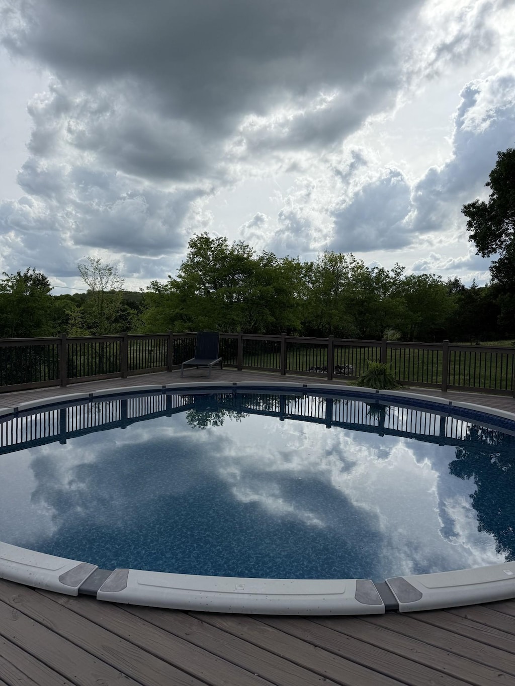 view of swimming pool featuring fence and a fenced in pool