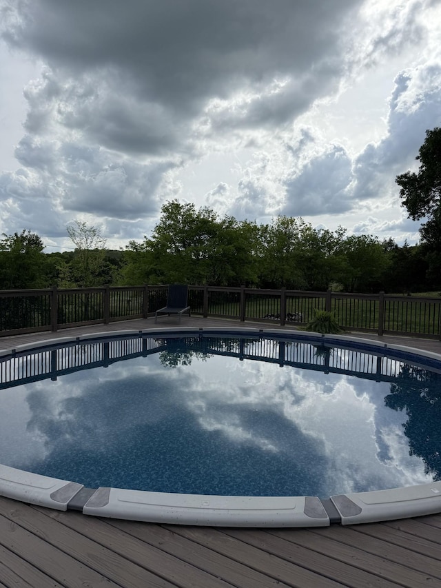 view of swimming pool featuring fence and a fenced in pool