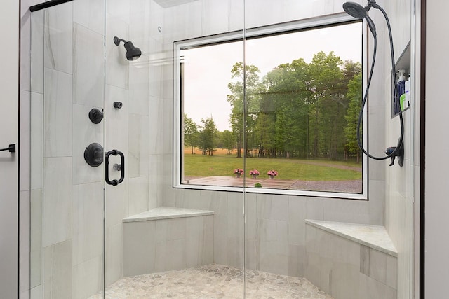 full bathroom with tiled shower