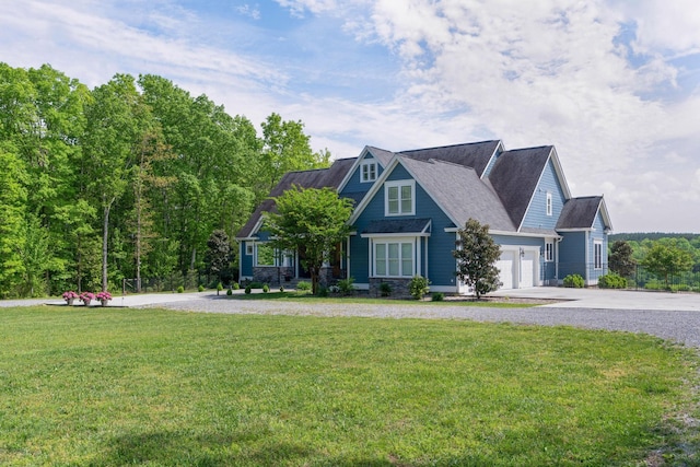 craftsman inspired home with a garage, concrete driveway, and a front yard