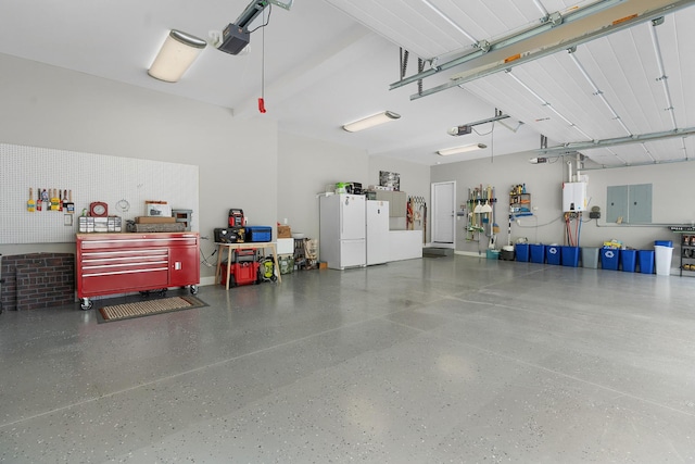 garage featuring a garage door opener and freestanding refrigerator