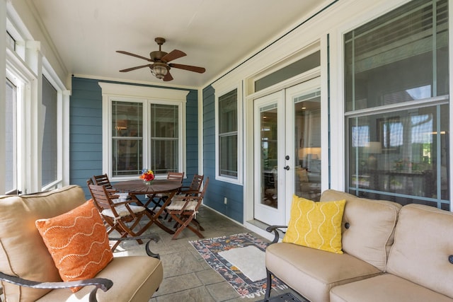 view of patio / terrace featuring french doors, a ceiling fan, and outdoor dining space
