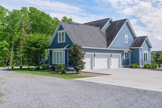 view of front of house featuring a garage, fence, concrete driveway, and roof with shingles