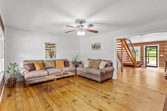 3124 Southall Rd, Franklin, TN 37064 - living room with light wood-style floors, ceiling fan, and stairs