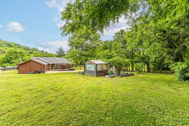 3124 Southall Rd, Franklin, TN 37064 - view of grassy yard featuring an exterior structure and an outdoor structure