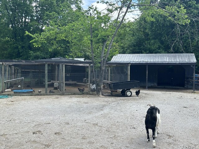 3124 Southall Rd, Franklin, TN 37064 - view of front of home with an outbuilding, a detached carport, and metal roof