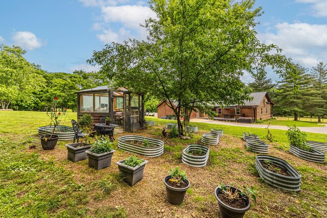 3124 Southall Rd, Franklin, TN 37064 - view of green lawn featuring a garden, a greenhouse, and an outbuilding