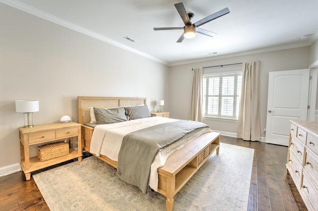 bedroom with crown molding, baseboards, dark wood-type flooring, and visible vents