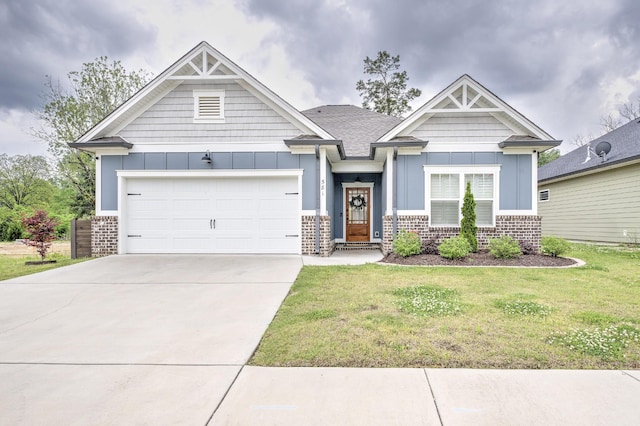 craftsman-style home with concrete driveway, board and batten siding, brick siding, and a garage