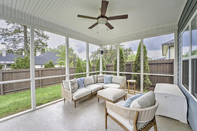 sunroom featuring ceiling fan and outdoor lounge area