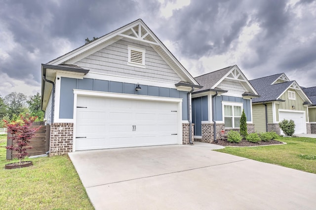 craftsman-style home with a garage, a front lawn, board and batten siding, brick siding, and driveway
