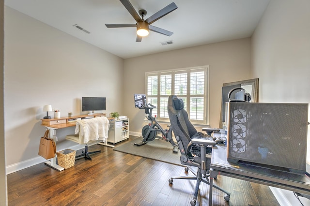 office area featuring ceiling fan, baseboards, visible vents, and wood finished floors
