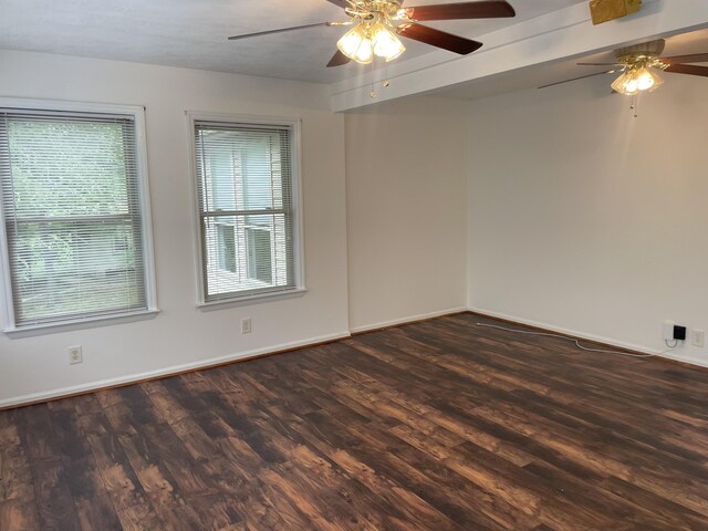 unfurnished room with baseboards, ceiling fan, and wood finished floors
