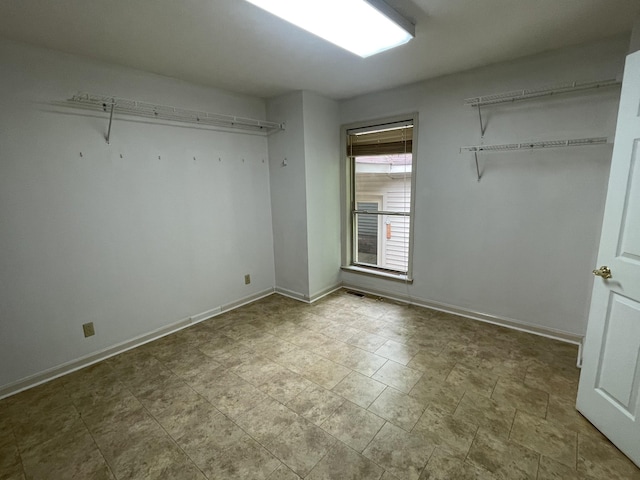 unfurnished bedroom with baseboards