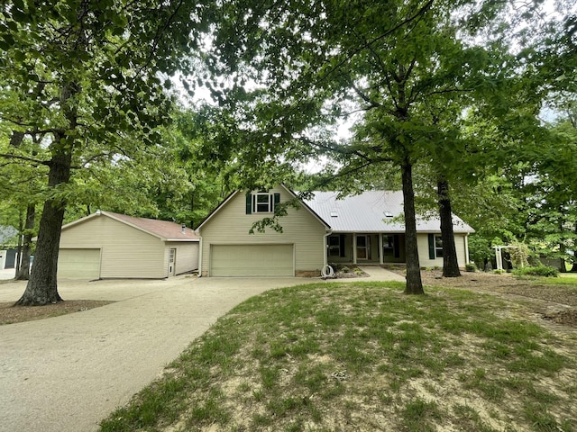 view of front of home with a porch and driveway