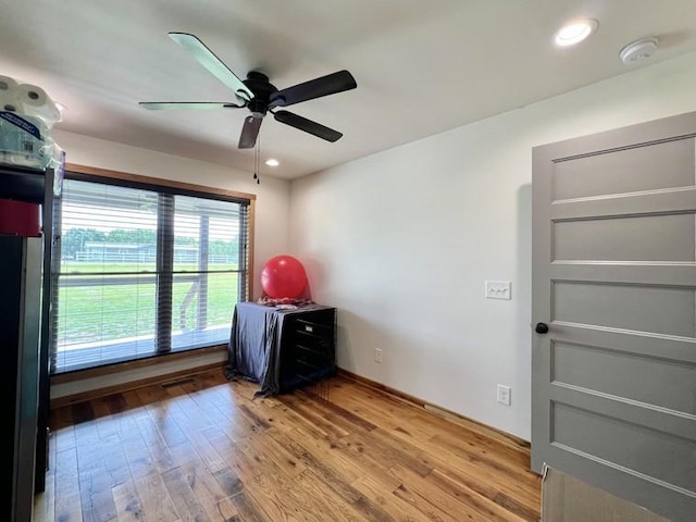 unfurnished bedroom with recessed lighting, ceiling fan, and light wood-style flooring