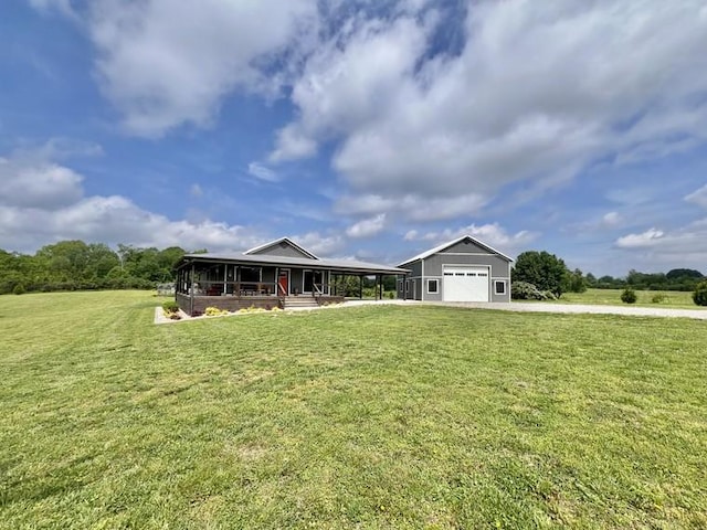 view of front of house with a garage, driveway, a porch, and a front lawn