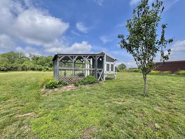 view of poultry coop with a yard