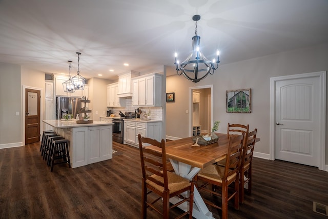 217 Rockhouse Rd, Hohenwald, TN 38462 - dining area featuring baseboards, dark wood finished floors, and a notable chandelier